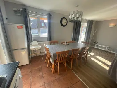 a kitchen and dining room with a table and chairs at Hengar Manor 4 bed Sleeps 9 in Saint Tudy