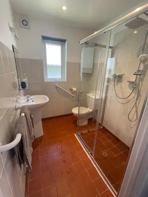 a bathroom with a shower and a sink and a toilet at Hengar Manor 4 bed Sleeps 9 in Saint Tudy