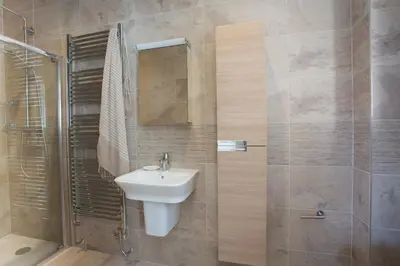 a bathroom with a sink and a shower at Scots Craig in St Ives