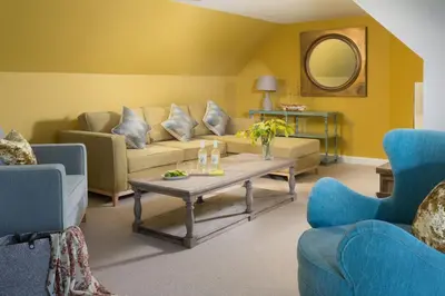 a living room with a couch and a table at Scots Craig in St Ives