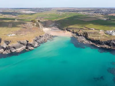 an aerial view of a beach and the ocean at 1 Bed in Helston oc-41377 in Cury