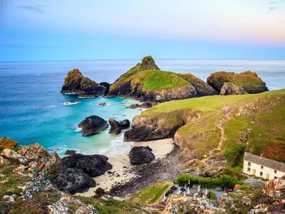 an aerial view of a beach with rocks and the ocean at 1 Bed in Helston oc-41377 in Cury