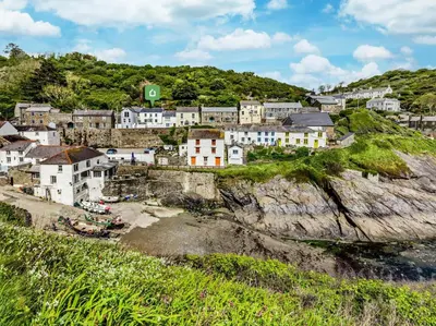 a town on a cliff near the ocean at 3 Bed in Truro oc-87260 in Portloe