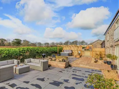 a patio with two couches and a fire pit at 4 Bed in Redruth oc-85825 in Gwennap