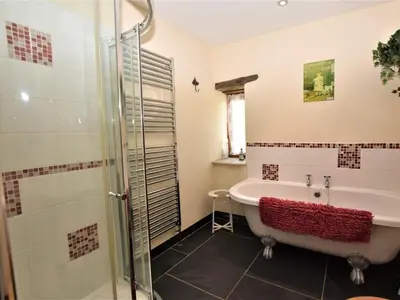 a bathroom with a tub and a shower at 2 Bed in Launceston oc-congs in North Hill