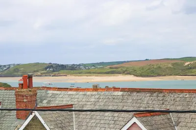a view of the beach from the roof of a building at Stylish townhouse in Padstow in Padstow