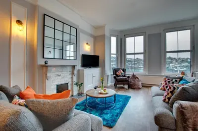 a living room with two couches and a fireplace at 3 Bed in Fowey oc-p00803 in Fowey