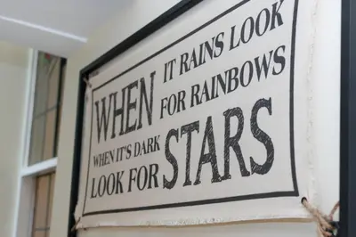 a sign on a wall that reads when it rains look for showers look for stars at 3 Bed in Fowey oc-p00803 in Fowey