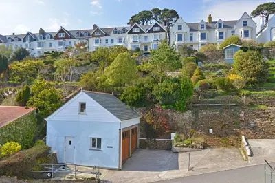 a small white house on a hill with houses at 3 Bed in Fowey oc-p00803 in Fowey