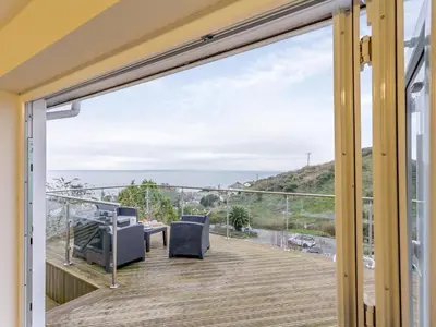 a balcony with a view of the ocean at 2 Bed in Torpoint oc-75402 in Downderry