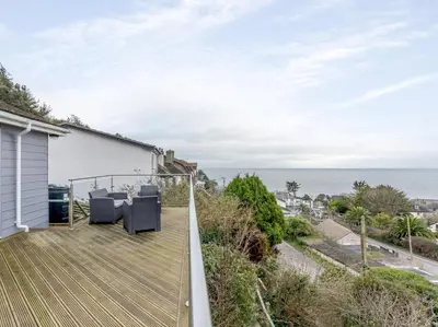 a view of the ocean from the balcony of a house at 2 Bed in Torpoint oc-75402 in Downderry
