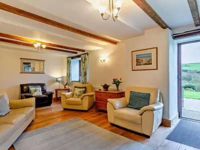 a living room with two couches and two chairs at 4 Bed in Boscastle oc-47035 in Boscastle