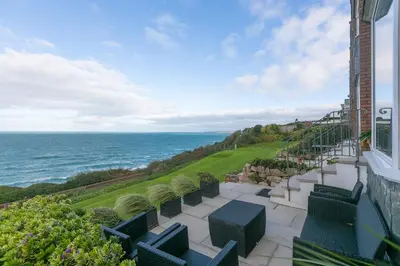 a view of the ocean from the balcony of a building at Ocean Edge in St Ives