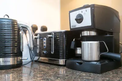 a black coffee maker sitting on top of a counter at Ocean Edge in St Ives