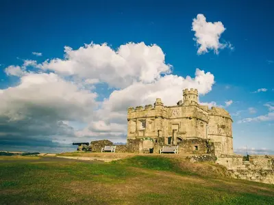 an old castle on top of a grass field at 2 Bed in Penryn oc-78621 in Penryn