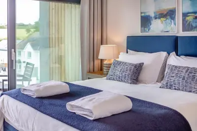 a bedroom with a bed with two pillows on it at 2 Bed in Harlyn Bay oc-a28321 in St Merryn