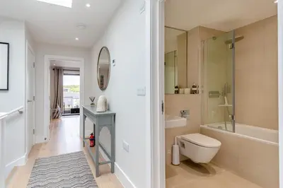 a bathroom with a toilet and a tub and a sink at 2 Bed in Harlyn Bay oc-a28321 in St Merryn