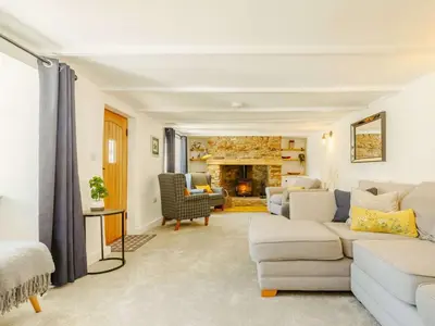 a living room with a couch and a fireplace at 3 Bed in Redruth oc-88102 in Redruth