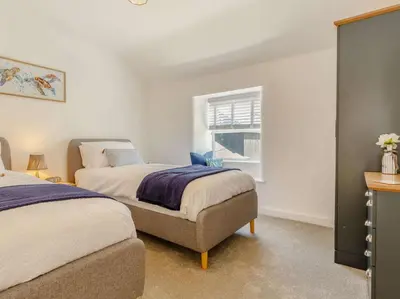 a bedroom with two beds and a window at 3 Bed in Redruth oc-88102 in Redruth