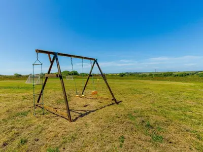 a swing set in the middle of a field at 3 Bed in Redruth oc-88102 in Redruth