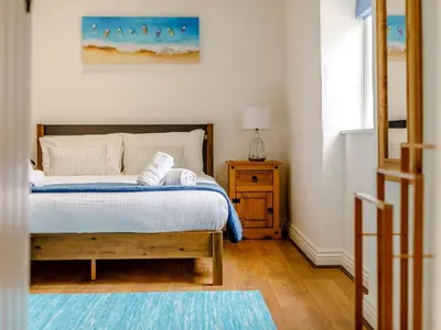 a bedroom with a bed with two towels on it at 2 Bed in Penryn oc-78620 in Penryn