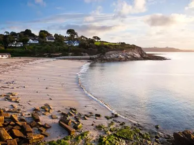 a view of a beach with rocks in the water at 2 Bed in Penryn oc-78620 in Penryn