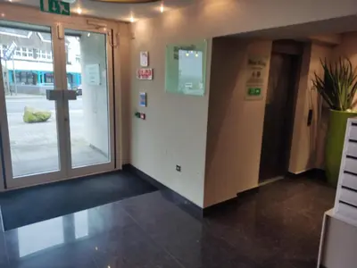 an office corridor with a door and a hallway with a door at Newquay Rocklands Beach View in Newquay