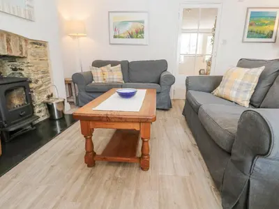 a living room with a couch and a coffee table at Kelsey in Truro