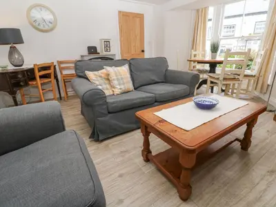 a living room with a couch and a coffee table at Kelsey in Truro