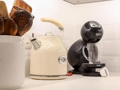 a coffee maker sitting on a counter next to a blender at Wildwood in Newquay