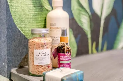 a table with two bottles of seasoning and a box at Luxury holiday home near the coast in Porthtowan