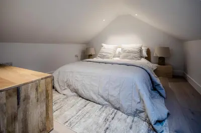 a bedroom with a large bed in a room at Lowen Tree House in Truro
