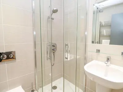a bathroom with a shower and a sink at Ocean View in St Ives