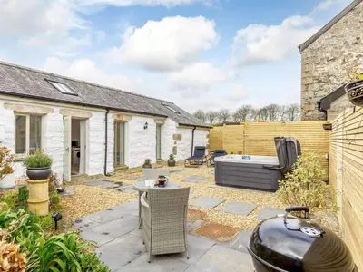 a garden with a hot tub in a backyard at 1 Bed in Redruth oc-85826 in Gwennap