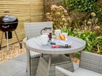 a table with a tray of food and coffee on it at 1 Bed in Redruth oc-85826 in Gwennap