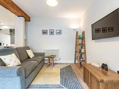 a living room with a couch and a flat screen tv at 1 Bed in St. Austell oc-42194 in Charlestown