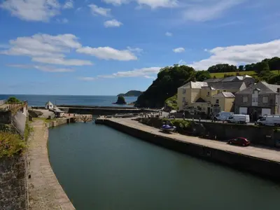a body of water with houses and the ocean at 1 Bed in St. Austell oc-42194 in Charlestown