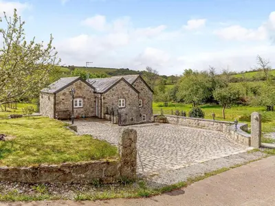 an old stone house with a stone driveway at 2 Bed in St. Austell oc-79594 in Saint Stephen