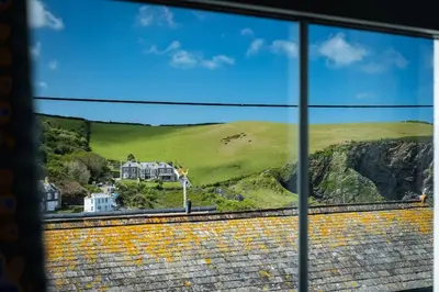 a view of a house from a window at Harewood, Port Isaac Bay Holidays in Port Isaac