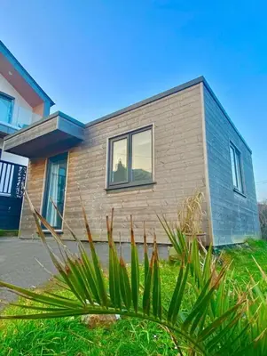 a small house is shown with plants in front at Casa Studio in St Ives