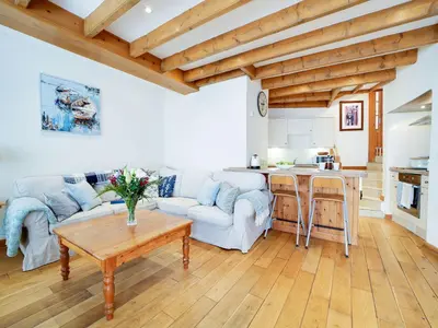 a living room with a couch and a table at Stanley House in Port Isaac