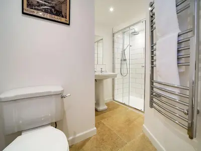 a bathroom with a toilet and a sink at Stanley House in Port Isaac