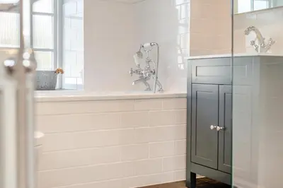 a bathroom with a shower and a sink and a tub at 4 Bed in St. Merryn oc-e28379 in St Merryn
