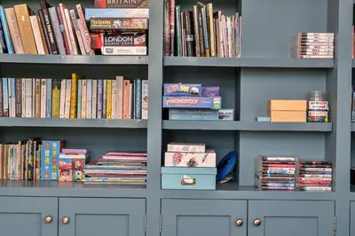 a book shelf filled with lots of books at Finest Retreats - Dingles Cottage in Philleigh