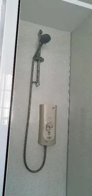 a shower head on a wall in a bathroom at 11 Granite Henge in Pelynt