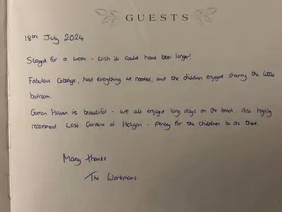 a handwritten letter on a whiteboard with handwriting at Ebb Tide - Fisherman's Cottage in Gorran Haven