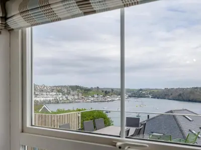 a window with a view of a body of water at 4 Bed in Polruan oc-pc044 in Fowey