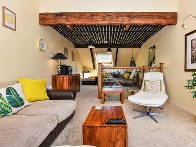 a living room with a couch and a table at 2 Bed in Fowey oc-75740 in Polruan
