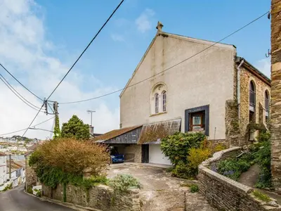 an old stone church on a street at 2 Bed in Fowey oc-75740 in Polruan