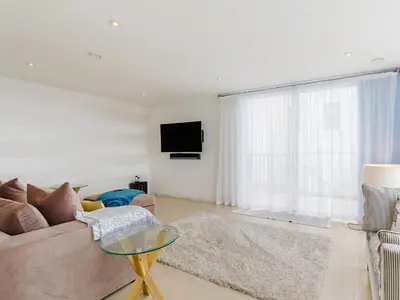 a living room with a couch and a tv at 5 Bed in Fowey oc-77657 in Polruan